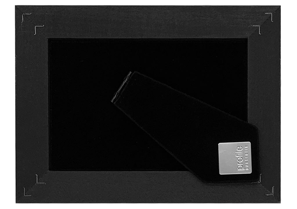 Plush black velvet flock backing with an easel style stand.