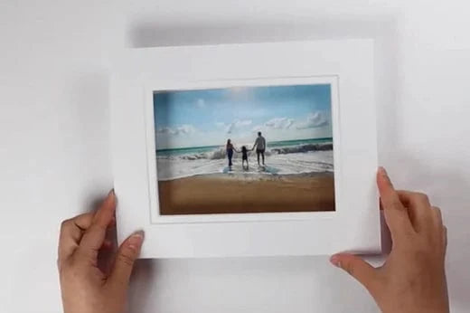 attaching a photo to a mat board