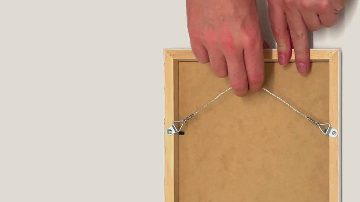 How to attach wir eto the back of a picture frame