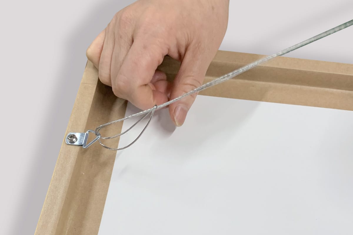 How to attach wire to the back of a photo frame