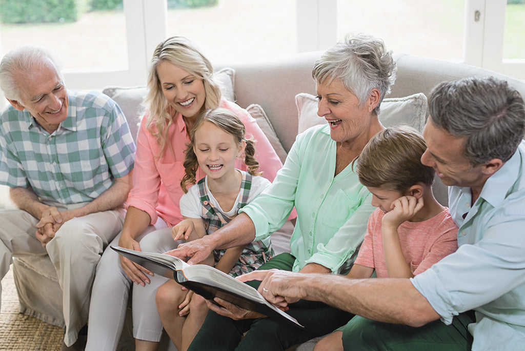 Family excited looking at a family photo album