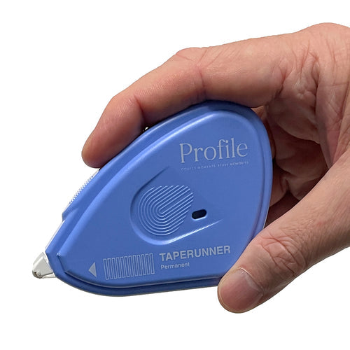 Someone holding a photo tape runner