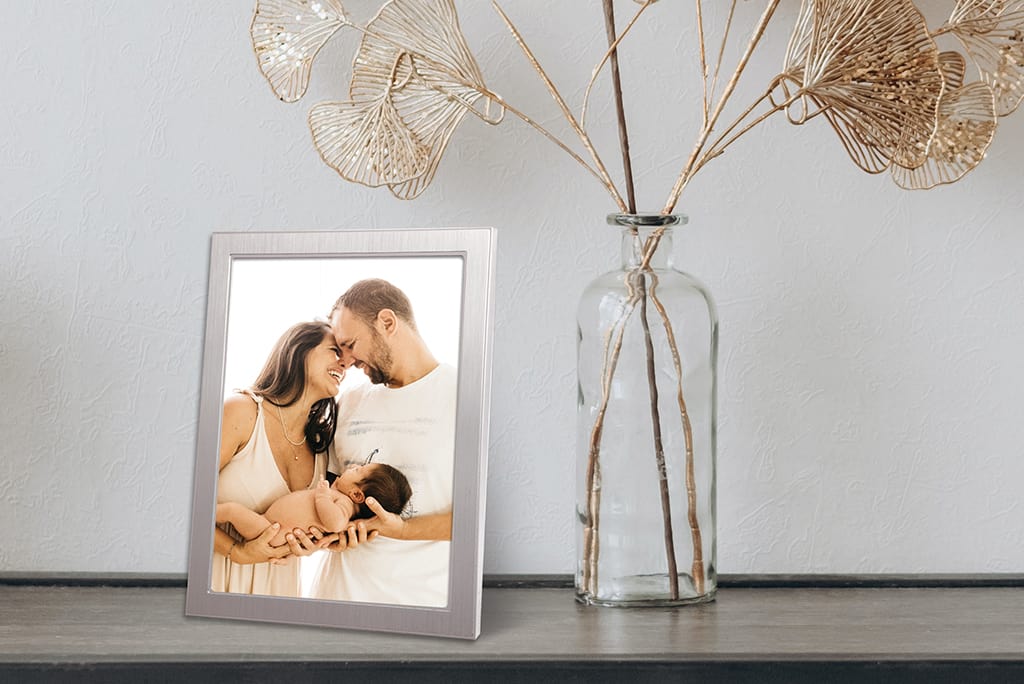 Arrangement of Family Photos Displayed in Silver Metal Photo Frames
