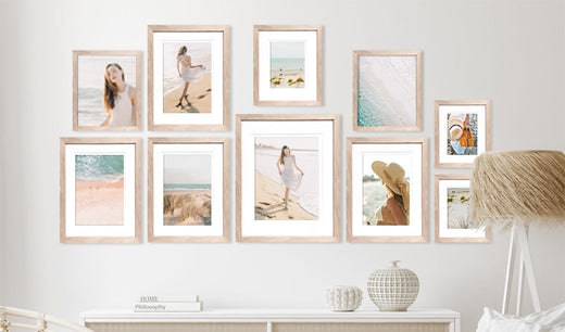Photo Wall of Oak Picture Frames with mixed art and portraits