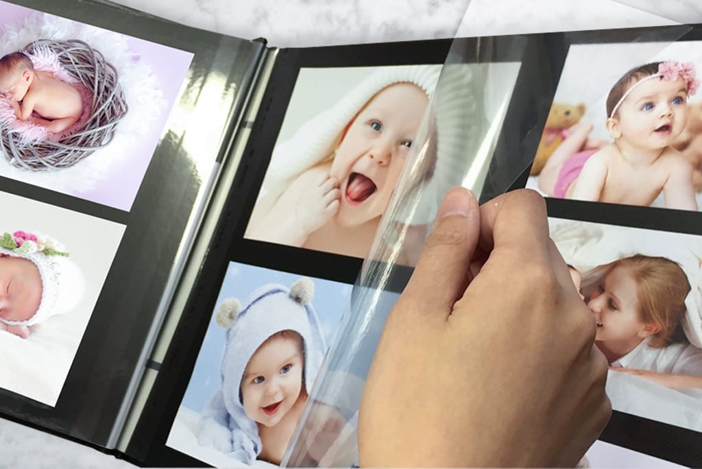 Self-adhesive photo albums