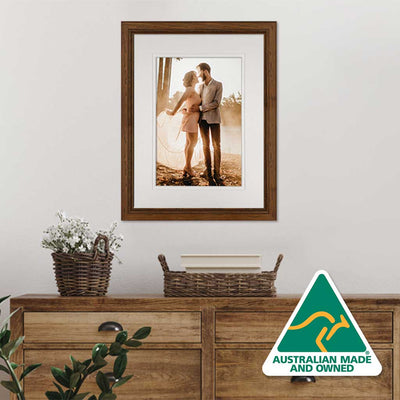12x16in walnut frame with wedding photo on wall