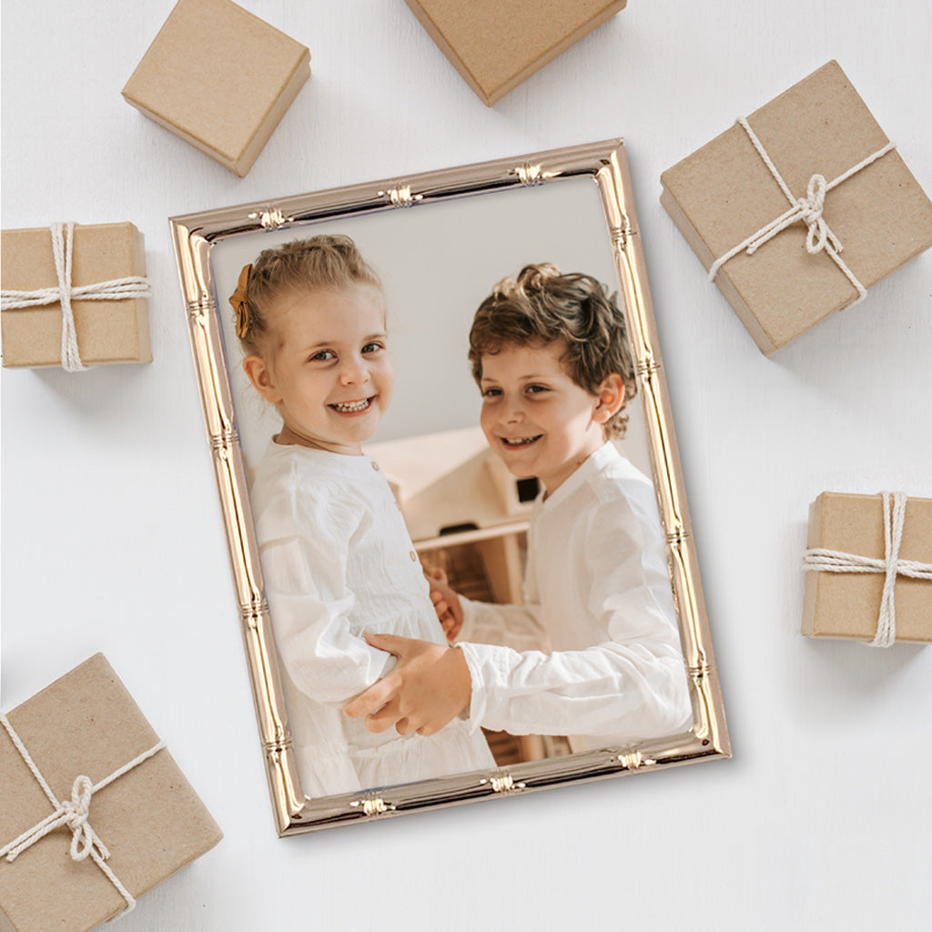 Christmas Gift Gold Metal Photo Frame with a photo of children.