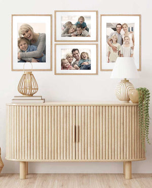 Picture frames on the wall with family photos