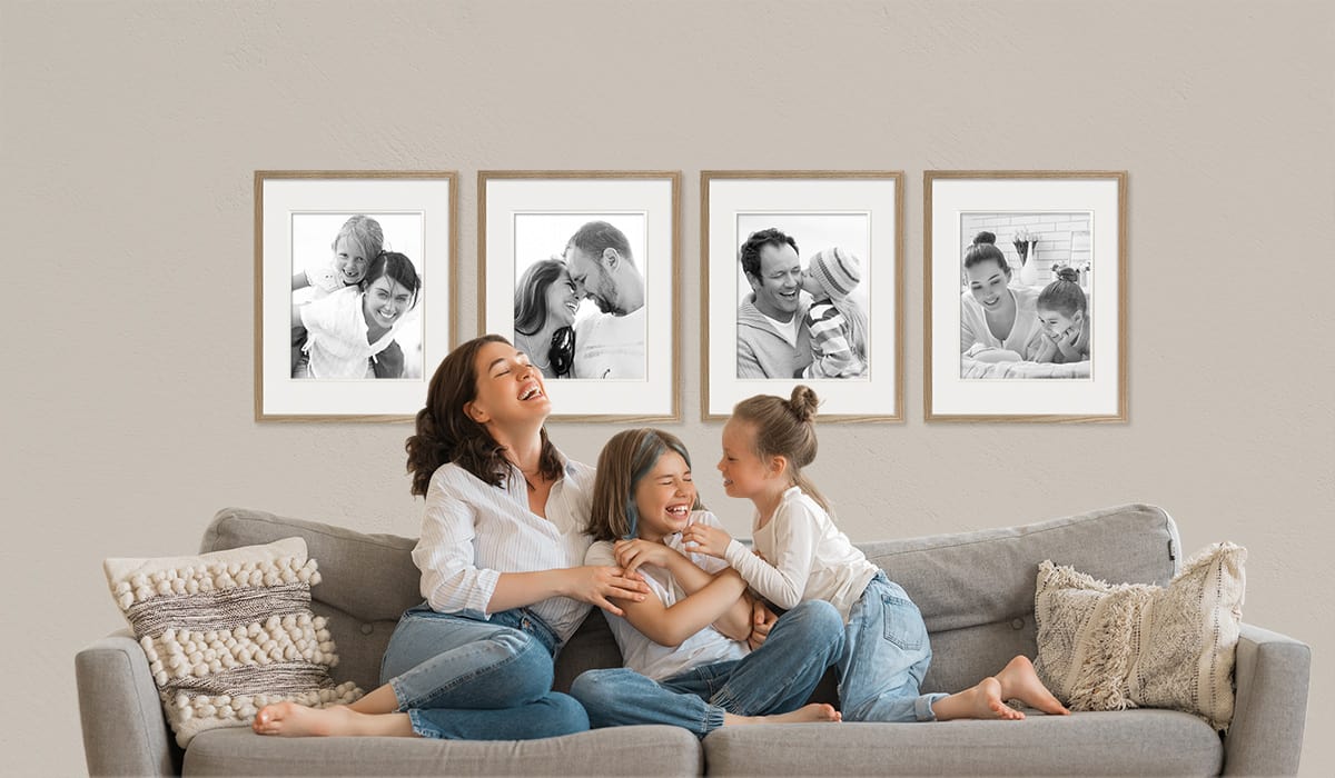 Family framed photos on wall. Timber picture frames made in Australia.
